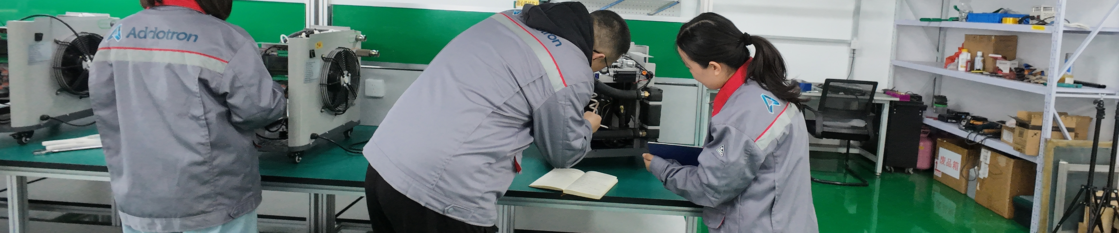 Factory team inspecting smart product assembly