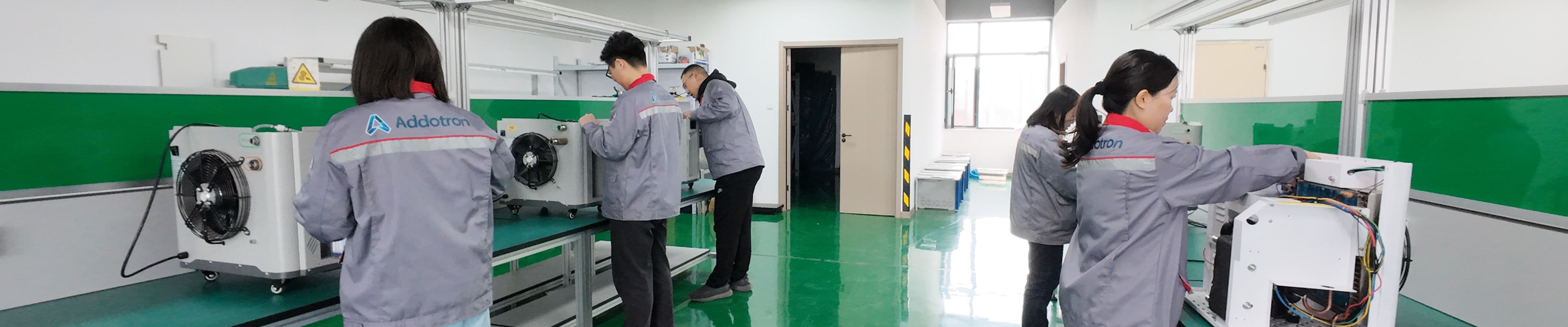 Factory team inspecting smart product assembly