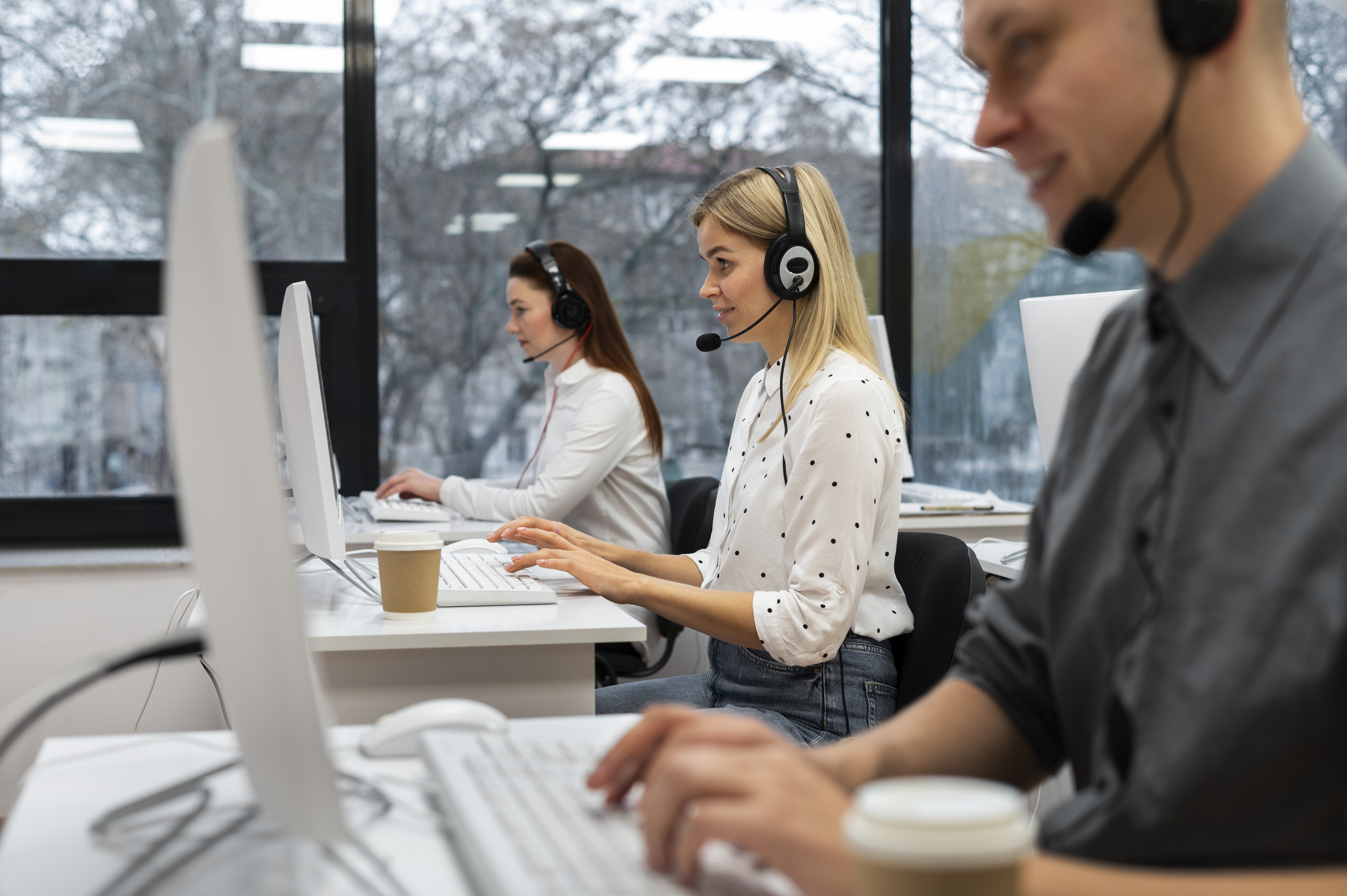 colleagues-working-together-call-center-office-with-coffee